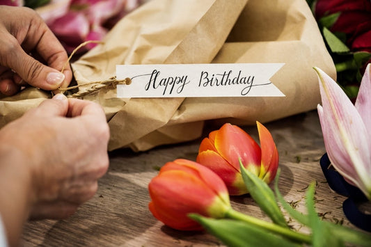 An image of a flower bouquet and a happy birthday label