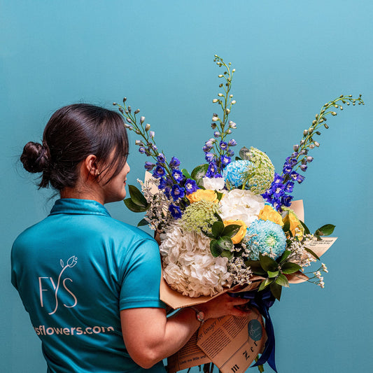 An image of a woman with a a bouquet of flowers